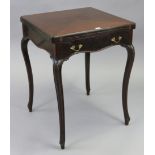 An Edwardian mahogany envelope-top card table inset green baize, fitted frieze drawer, & on four