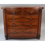 A Victorian mahogany bow-front chest, fitted two short & three long graduated drawers with turned