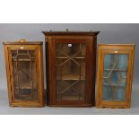 A mahogany hanging corner cabinet, with moulded dentil cornice & fitted two shaped shelve enclosed