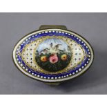 A late 18th century English enamel oval patch box of blue ground, the hinged lid painted with a