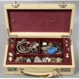 A quantity of various costume jewellery, contained in a cream leather jewellery box.