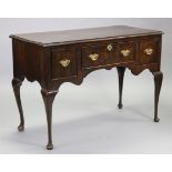 An 18th century style walnut side table, fitted three frieze drawers with shaped brass swan-neck ha