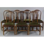 A set of eight 19th century mahogany Hepplewhite style dining chairs, with pierced splats to the