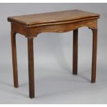 An 18th century mahogany serpentine-front rectangular card table, with fold-over top inset green