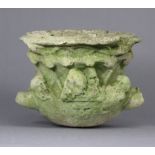 A sculpted limestone classical urn with Bacchanalian relief decoration, 8” wide x 6½” high (