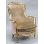 A 19th century Louis XV style armchair with foliate-carved beech frame, the shaped padded back,