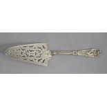 An early Victorian silver small cake slice with pierced triangular blade & shell terminal to the