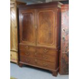 A George III inlaid mahogany linen press with moulded cornice, fitted four sliding trays enclosed by