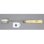 A William IV silver cheese scoop with push-slide, & engraved family crest to the plain ivory handle,