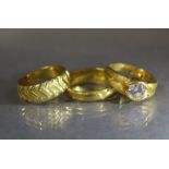A Chinese yellow metal ring set large simulated diamond, the adjustable split shank marked “