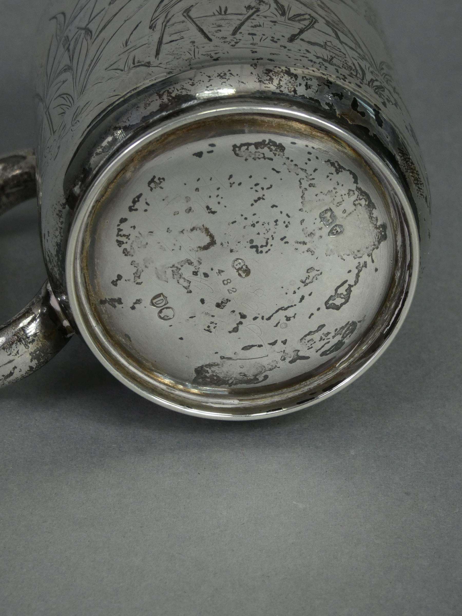 A Victorian silver half-pint mug of straight-sided form with engraved decoration of wading birds - Image 3 of 3