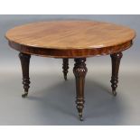 A Victorian mahogany extending dining table with one additional leaf, having moulded edge to the top