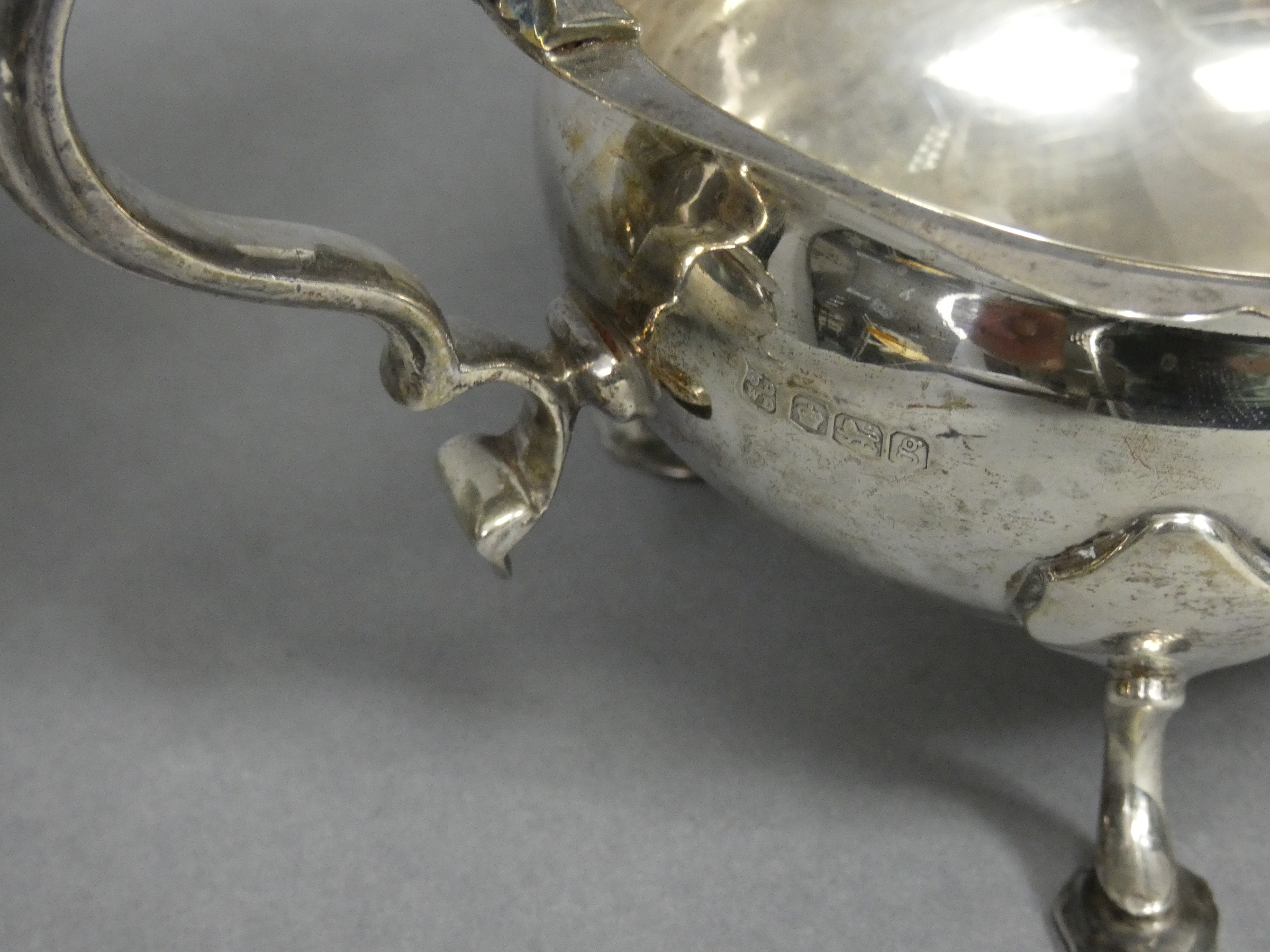 A pair of Georgian-style silver sauce boats with card-cut rims & scroll handles, each on three splay - Image 2 of 4