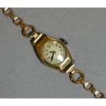 A 1930’s 9ct. gold cased ladies’ wristwatch, the circular white dial with Arabic numerals, London