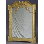 A George II style pine rectangular wall mirror with carved foliate scroll surmount & egg-&-dart