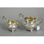 A William IV silver two-handled sugar bowl & milk jug of squat round form, with engraved floral