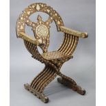 An eastern mother-o-pearl inlaid folding Savonarola-type armchair, with all-over foliate designs,