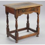 An 18th century joined oak side table with moulded edge to the rectangular top, fitted single frieze