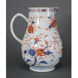 An 18th century Chinese Imari porcelain large sparrow beak jug with all-over floral decoration, loop