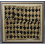 A rectangular textile panel of camel ground, with repeating geometric lozenge design, 20½” x 19¼”,