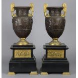 A pair of 19th century neo-classical style bronze & gilt brass urns, each with foliate scroll