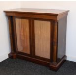 A REGENCY MAHOGANY CHIFFONIER with rectangular overhang top above a pair of velvet-lined glazed