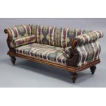 A mid-Victorian mahogany sofa with foliate carved scroll arms, padded back & sprung seat upholstered