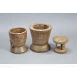 Three African carved hardwood mortars, 13½”, 12”, & 7¾” high.