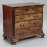 A George III mahogany small chest, with moulded edge to the rectangular overhang top, fitted