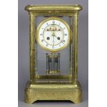 A 19th century French four-glass mantel clock in gilt-brass case with engraved decoration, the 4”