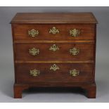 A Georgian mahogany small chest, with moulded edge to the plain rectangular top, fitted three long