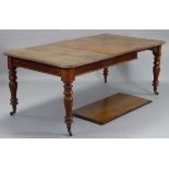 A Victorian mahogany extending dining table, with rounded corners & moulded edge to the