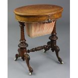 A Victorian burr-walnut oval work table with hinged top enclosing satinwood interior fitted with