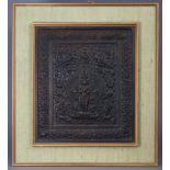 An Indian carved hardwood plaque with all-over relief decoration depicting Shiva surrounded by