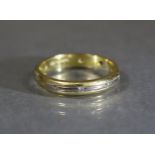 An 18ct. gold eternity ring set nine small diamonds; size: L, weight: 3.4 gm.