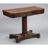 An early Victorian rosewood card table, with rounded corners to the rectangular fold-over top, inset