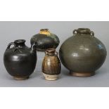 A group of four Chinese Song dynasty pottery vessels, comprising a green-glazed two-handled globular