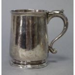 A George II provincial silver mug of slightly tapered form, with rounded base & circular moulded