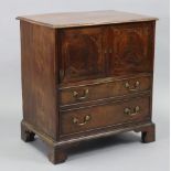A mahogany small rectangular chest commode, with moulded edge to the hinged lift-top, faux panel