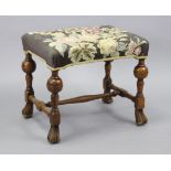 A walnut William & Mary-style rectangular stool with floral needlework seat & on bulbous-turned legs