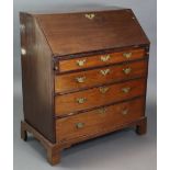 An 18th century mahogany bureau, with fitted interior enclosed by a fall-front above four long