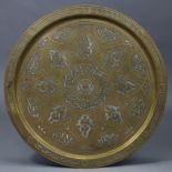 A Persian brass circular tray with silver & copper inlaid decoration, 19½” diam.; & a similar