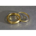 Two 22ct. gold plain bands, sizes H/I & L; total weight: 6.3 gm.