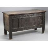 An 18th century oak coffer, with moulded edge to the two-board top & original hinges, the interior
