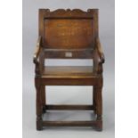 A 17th century WELSH JOINED OAK WAINSCOTE CHAIR with shaped & pierced top-rail, panelled back,