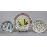 A 19th century French faience shallow bowl with painted floral decoration 12¾” diam.; a similar