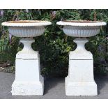 A PAIR OF VICTORIAN LARGE CAST-IRON GARDEN URNS, each with egg-&-dart rim, 29” wide x 42” high (