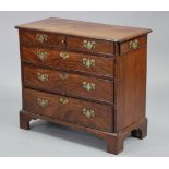 An 18th century mahogany small chest of drawers with crossbanded rectangular top, fitted one short