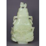 A Chinese pale green jade vase & cover of flattened baluster form, with lion-dog finial & lingzhi