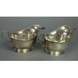 A pair of George V silver sauce boats with egg-&-dart rims, each on oval spread foot, 6¾” long;